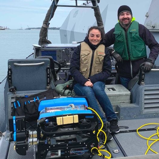 Stevens professor Brendan Englot and student with underwater robot on a dock