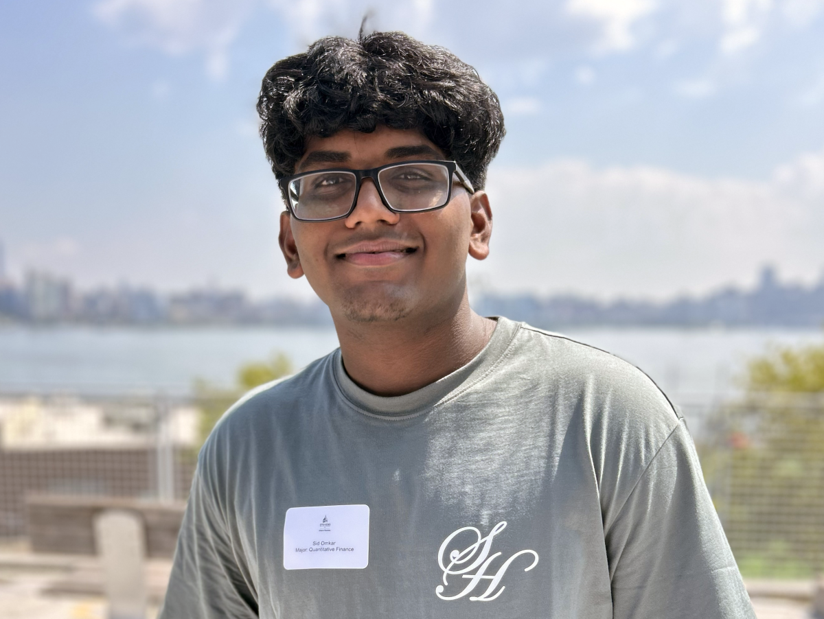 Sid Onkar stands on the patio of the Babbio Center.