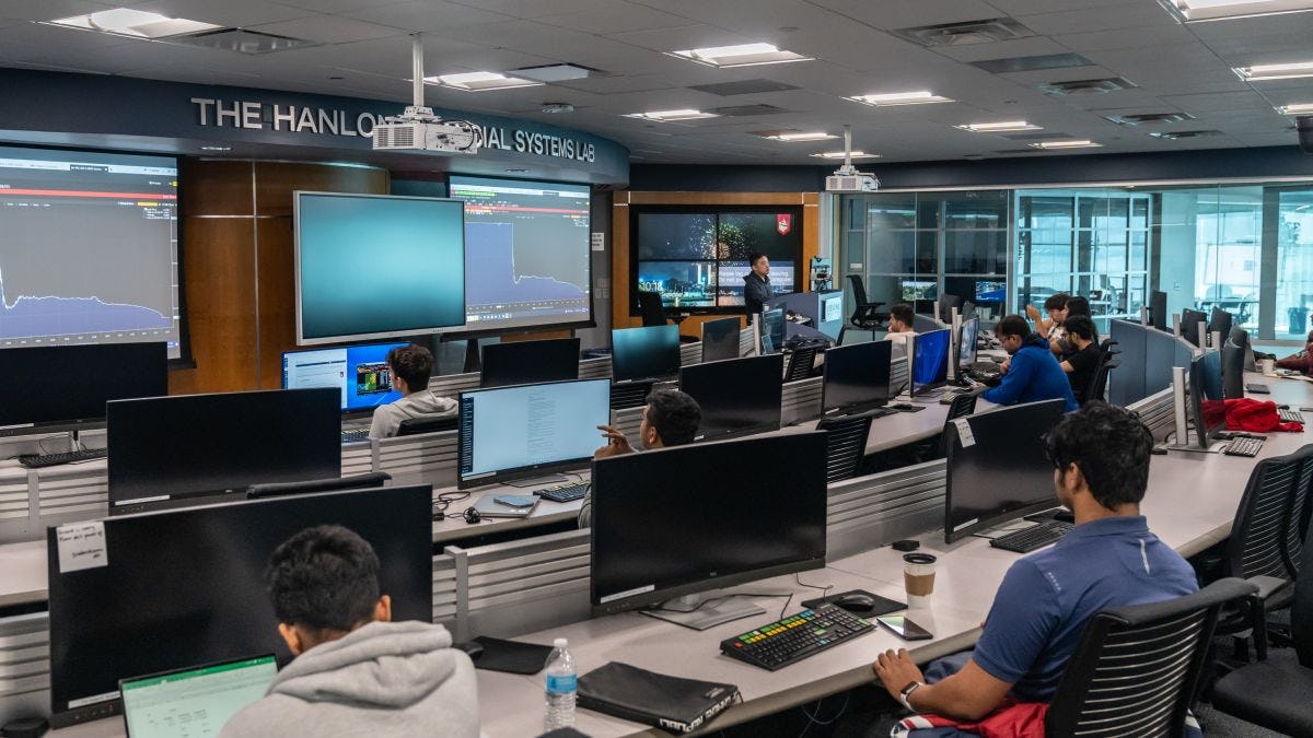 The Hanlon Financial Systems Lab with computer monitors and screens.