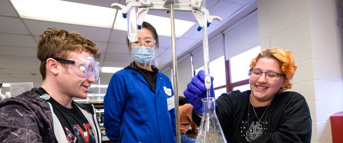 Chemistry and Chemical Biology students work with lab equipment.