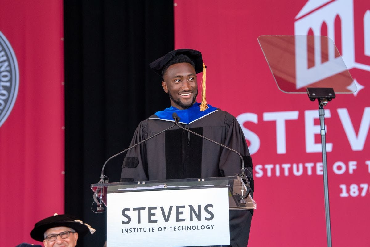 Marques Brownlee delivering his 2024 commencement address on stage.