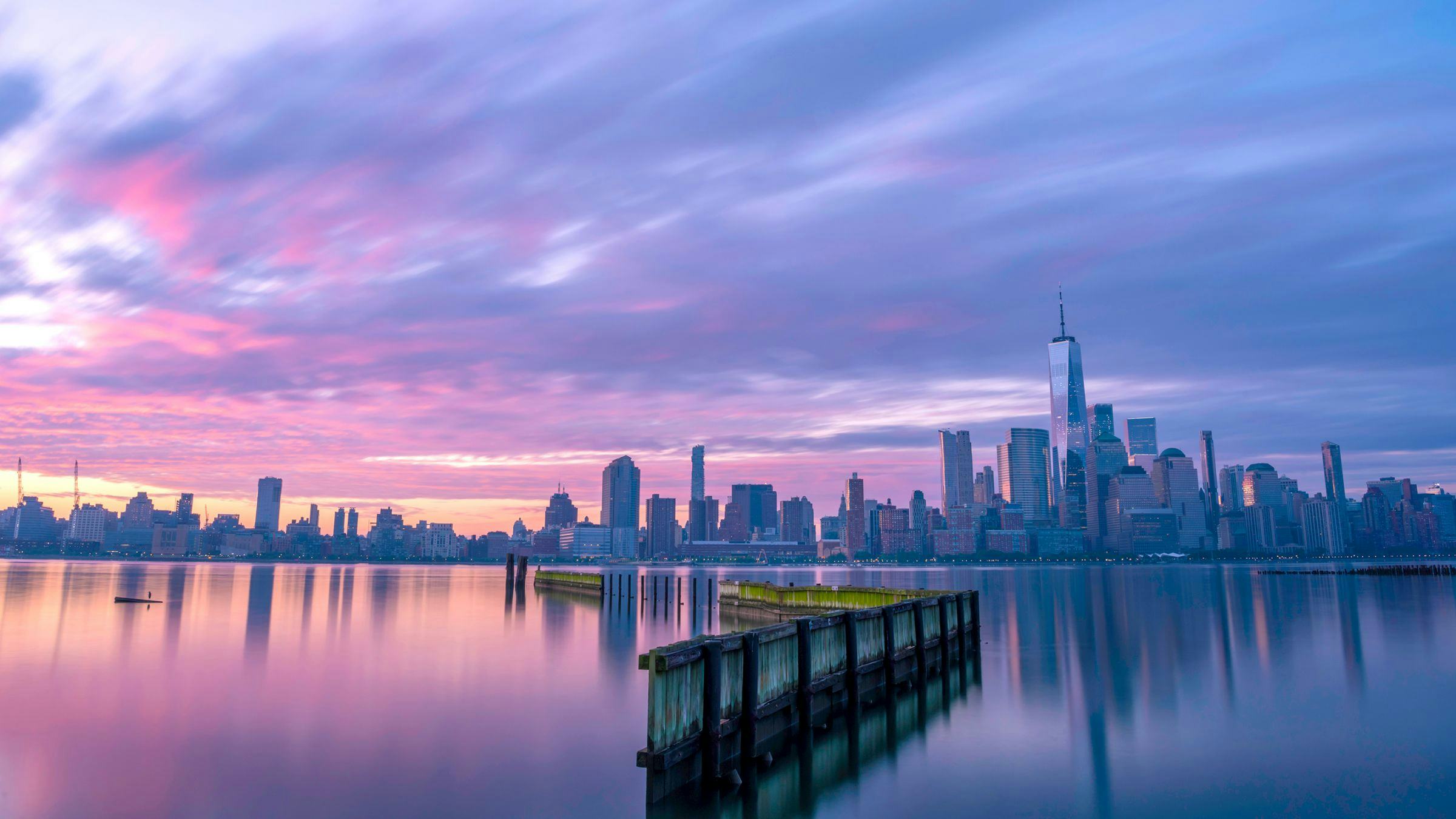 sunset along the Hudson River with the WTC and New York City skyline