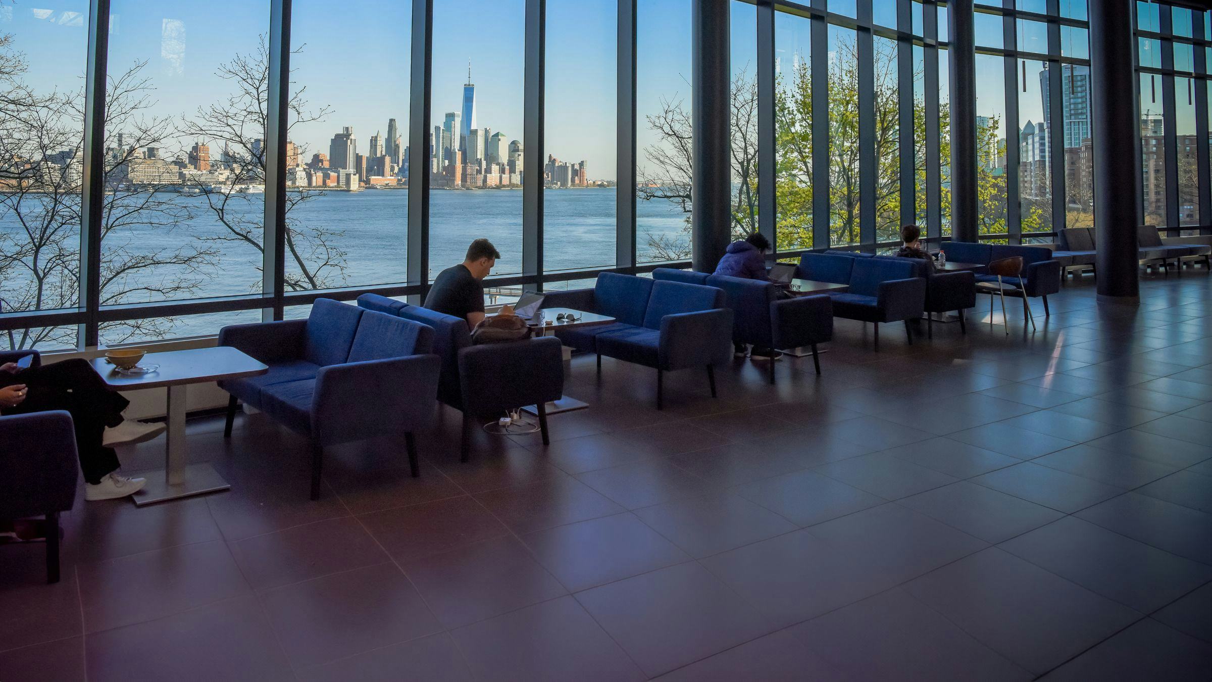 Students studying with NYC skyline in the background