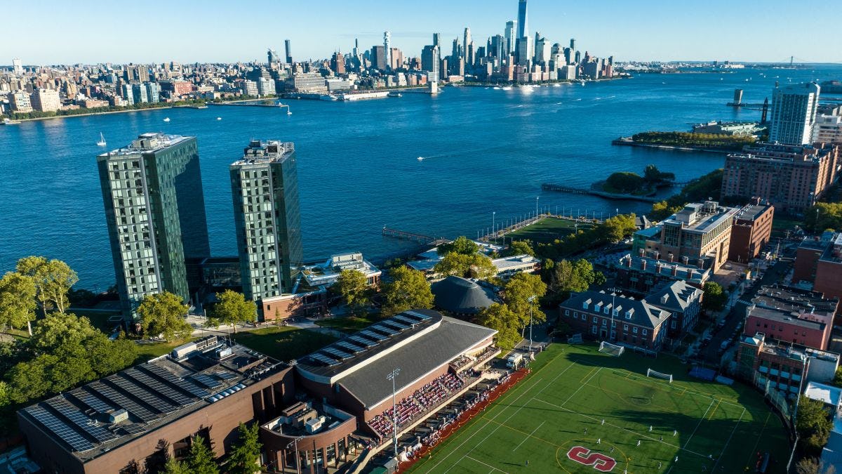 an aerial view of campus, the Hudson River and the NYC skyline