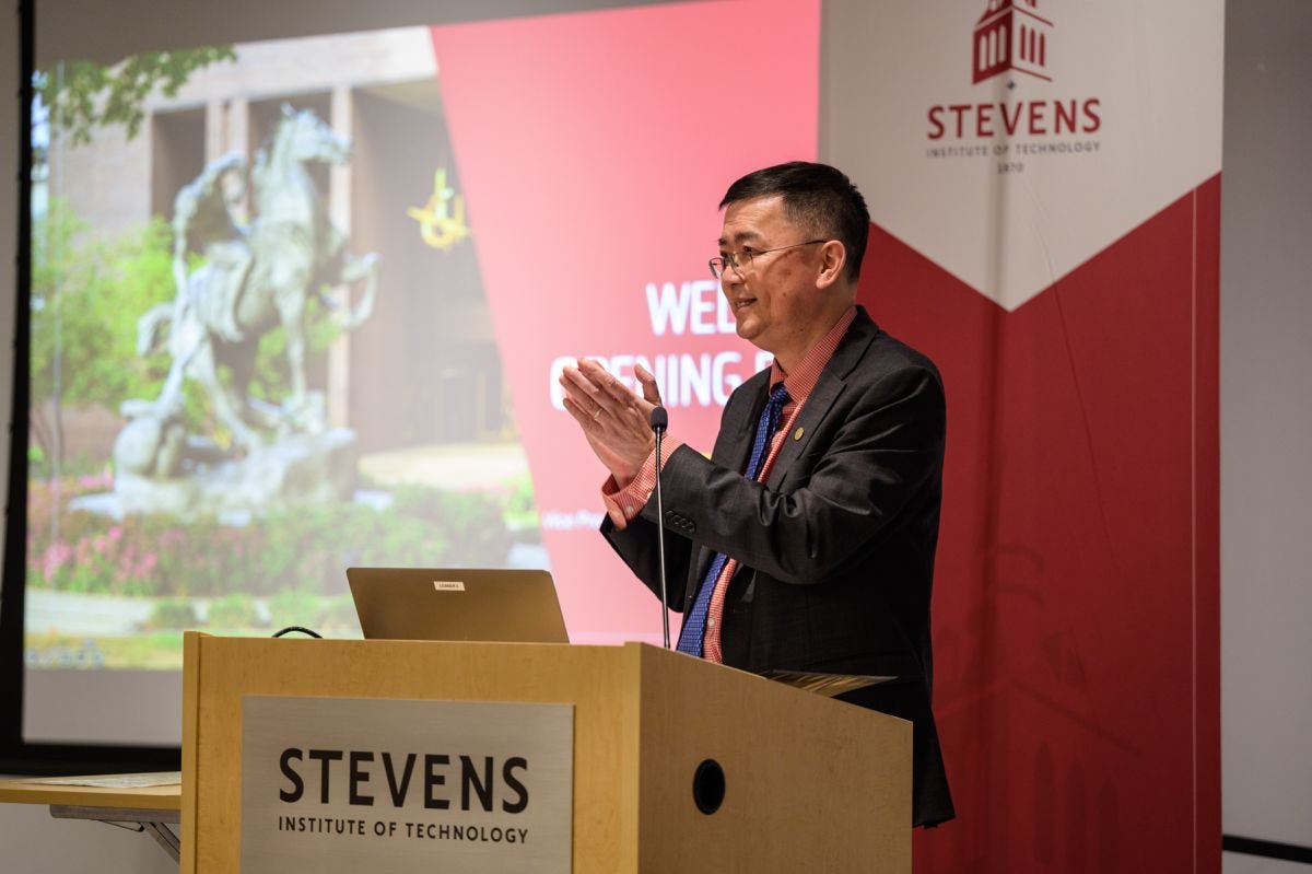 Stevens official David Zeng on podium at awards ceremony