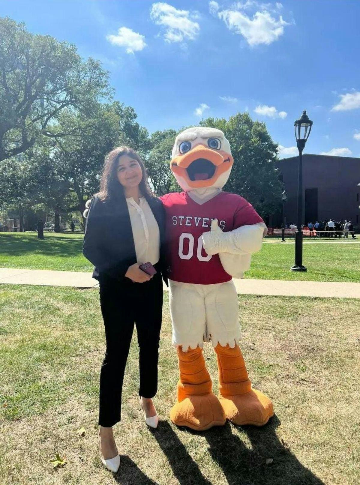 Kaushal poses with Stevens mascot, Attila the Duck. 