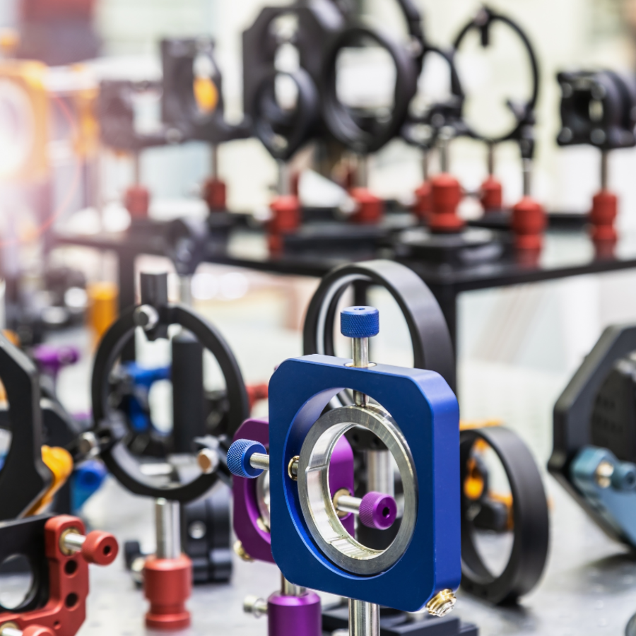 optics and laser holders with motorized positioners on an optical table